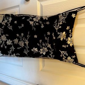 Dress, fits true to size, black with silver flowers not itchy.